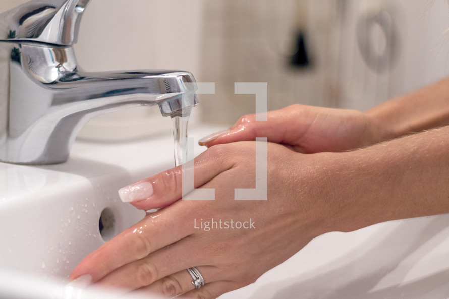 hand washing in a sink 