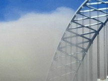 Bridge structure coming through the clouds