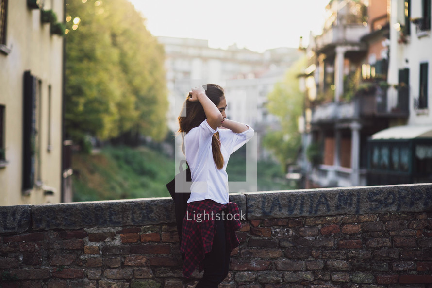 teen girl standing outdoors 