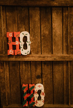 Ho Ho wooden decoration on shelves 