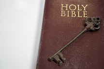 Skeleton key on the cover of a Bible 