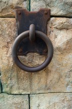 metal ring on a stone wall 