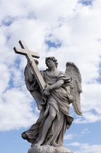 angel statue holding a cross