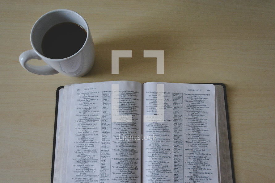 open Bible and coffee mug