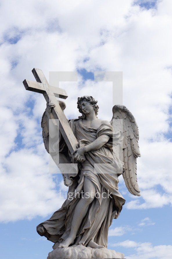 angel statue holding a cross