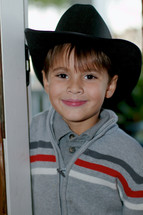 boy child wearing a cowboy hat