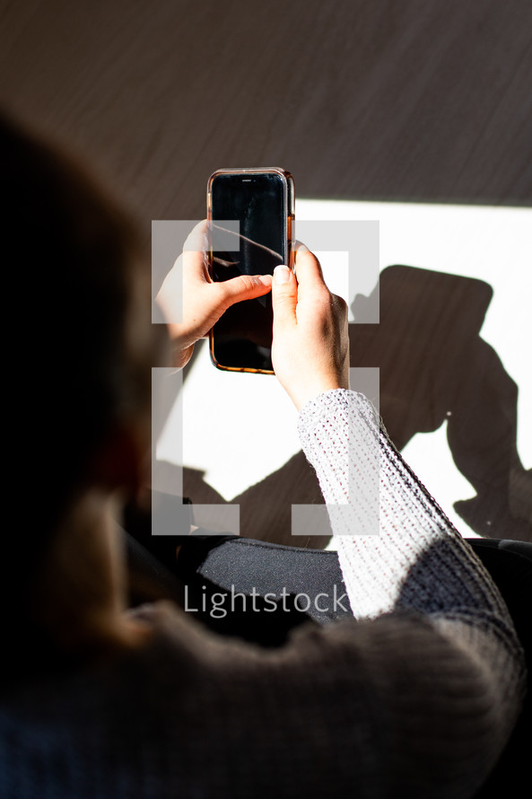 woman looking at her smartphone 