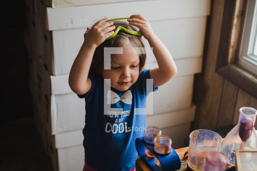 a toddler doing science experiments 