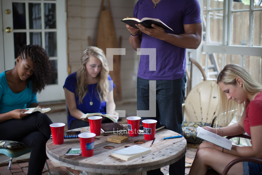 reading Bibles in a small group Bible study 