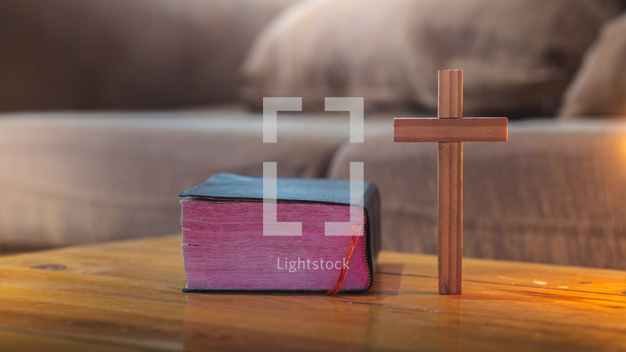 Bible and cross on a table 