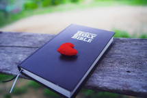 Red fabric heart on a Bible