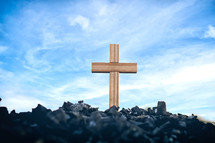 cross in ashes and blue sky 