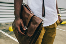 man with a leather satchel 