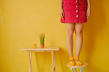 girl standing on a table 