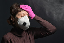 Female wearing a face mask and gloves 