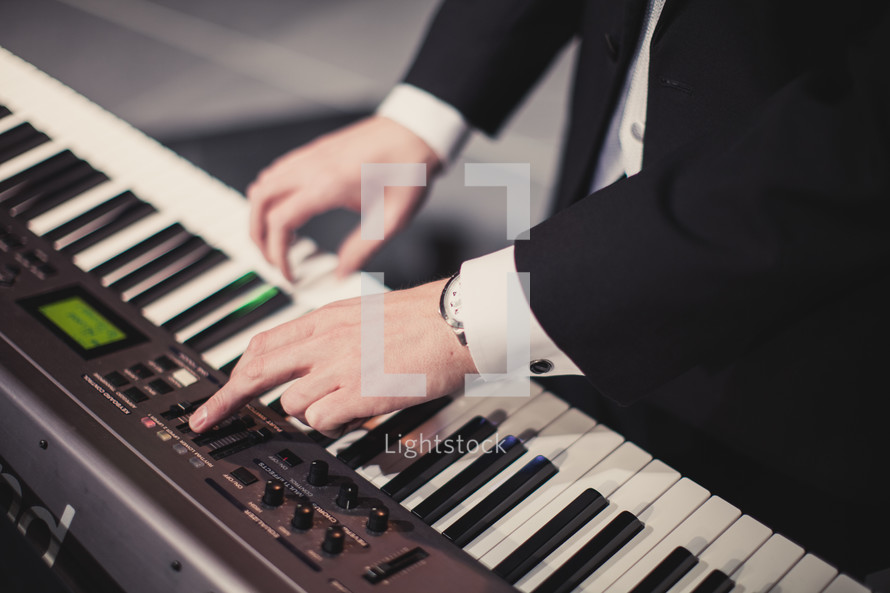 A man playing a keyboard 
