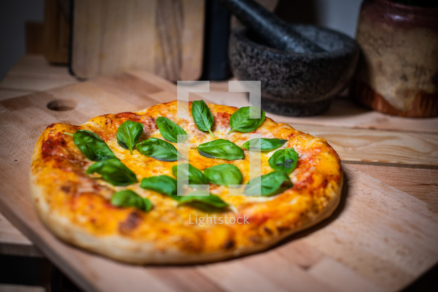 Authentic Neapolitan Pizza with Fresh Basil on Wooden Board