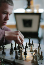 boy playing chess 