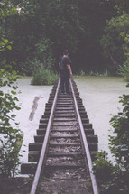 man standing on the tracks 