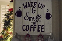 Wake up and smell the coffee sign and Christmas tree 