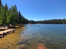 crowds at a lake in summer 