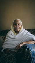 a smiling/ happy elderly woman