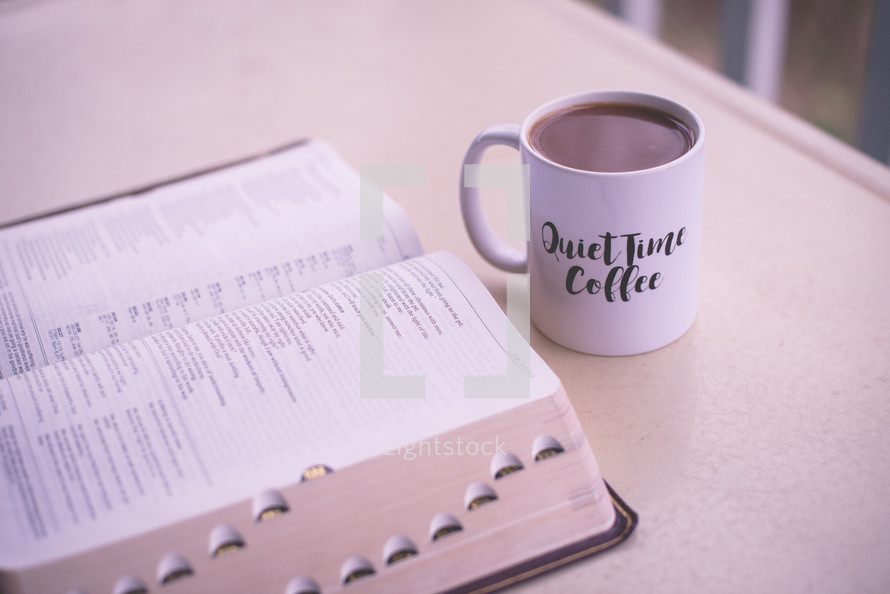 quiet time coffee mug and open Bible 
