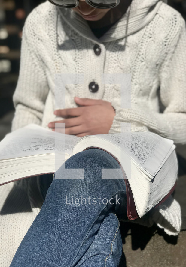 girl reading a Bible 