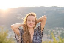 Young woman portrait. Young woman at sunset. Rhone valley in the background.