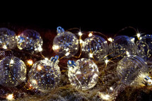 clear glass ornaments and fairy lights 
