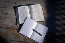 A an open Bible and journal.
