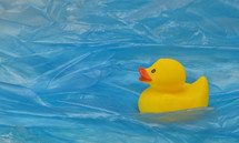 Concept Pollution Plastic In Sea with Yellow Rubber Duck Toy 