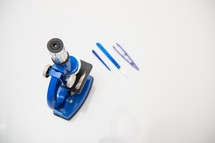 microscope isolated on a white background with research tools