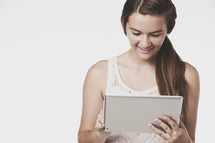 teen girl holding an iPad 