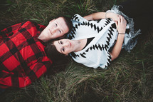 a couple lying in the grass