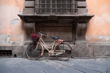 bike leaning against a wall 
