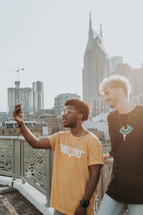 friends taking a selfie in a city 