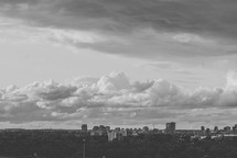 clouds over city buildings 