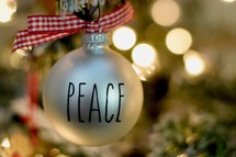 word Peace on a Christmas ornament 