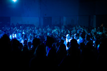 audience under blue light 