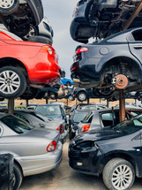stacked cars on car scrapping center