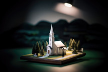 Miniature model of christian church on dark background. Christmas and New Year concept