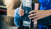Christian person holding passport and money with bible for mission, christian concept.