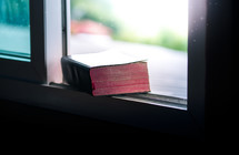 Bible in a window sil 