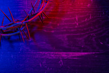 a crown of thorns on a blue and red background 