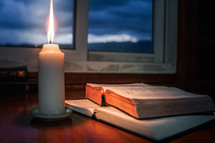 Bible with candlelight