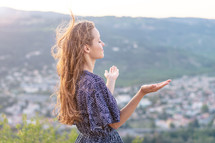 Young woman portrait. Young woman at sunset. Rhone valley in the background.