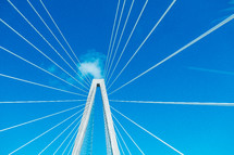 bridge support cables and a blue sky