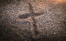 cross imprint in gravel 