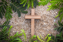 wood cross on gravel 